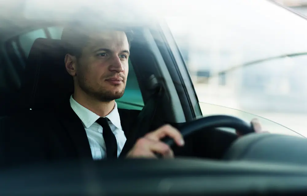 Chauffeur waiting with black car for point to point car service phoenix