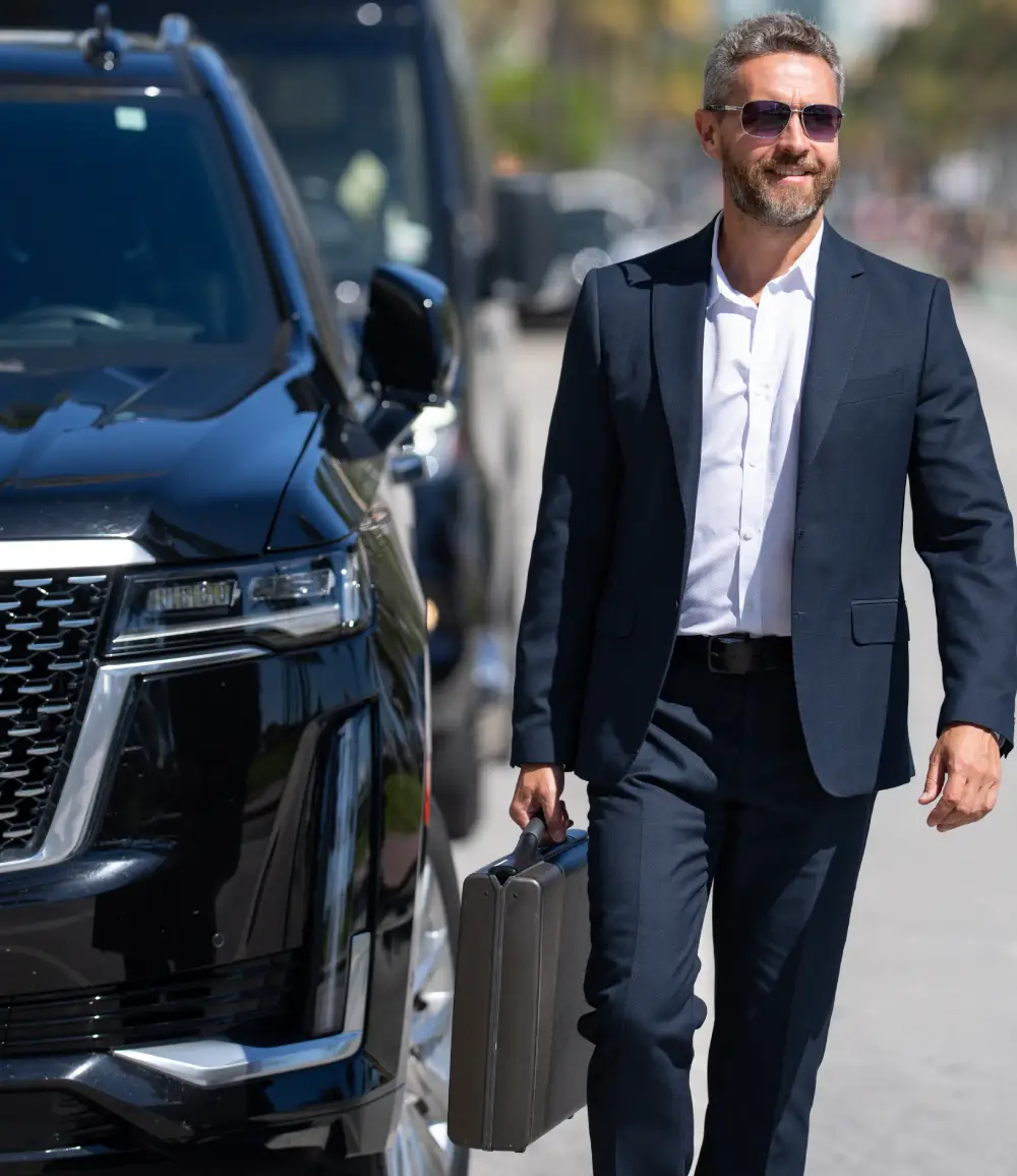 Driver with black SUV for point to point chauffeur service Scottsdale